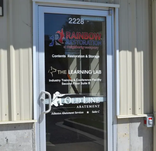 The Rainbow Restoration of Northeastern Maryland branch sign displayed outside their local office.