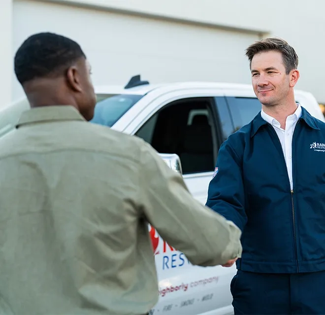 A Rainbow Restoration representative meets a property owner who has called for help with emergency restoration services in Inman, SC.