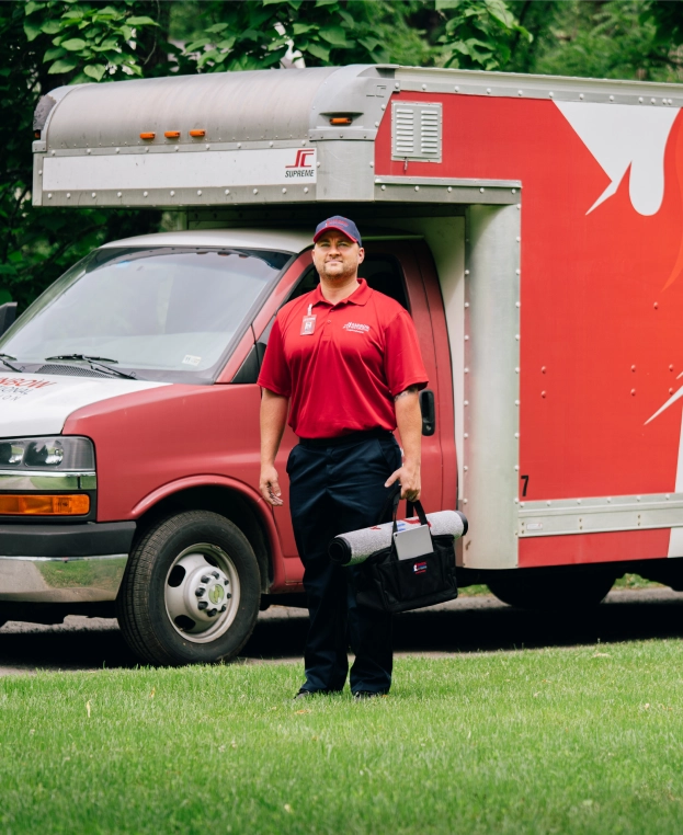 Rainbow Restoration professional approaching van.