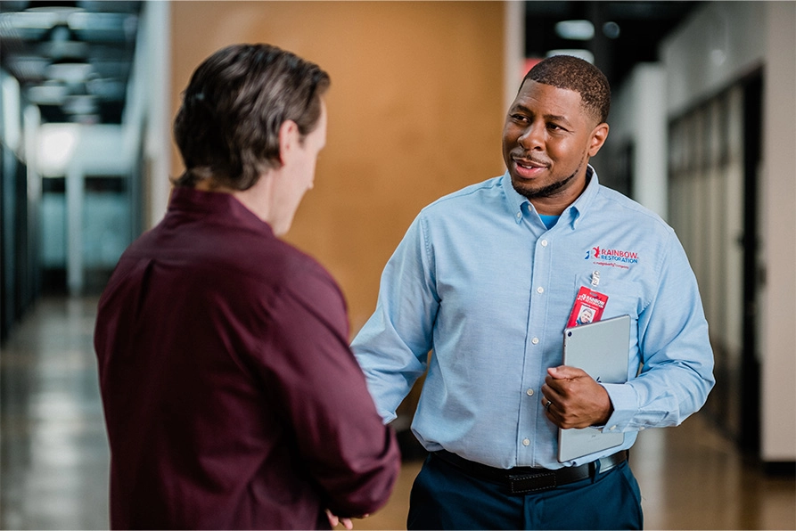 A Rainbow Restoration of Dickinson project manager greets a property owner dealing with a commercial loss in Texas City, TX.