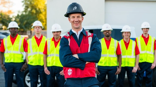 Rainbow Restoration commercial team with bright vests.