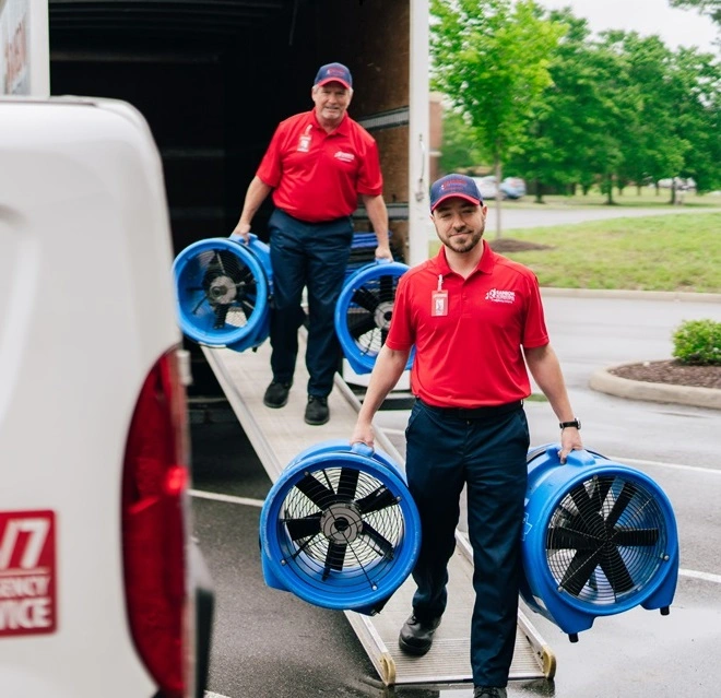 Rainbow Restoration service professional arrives at a home to provide smoke and fire damage restoration services.