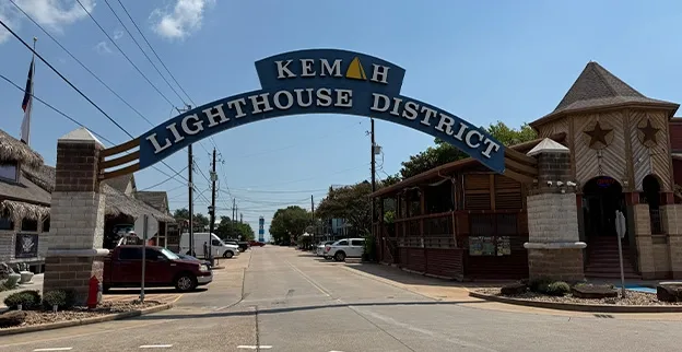 The entrance to the Kemah Lighthouse District, the town center with shops, restaurants, and the Kemah Boardwalk. 