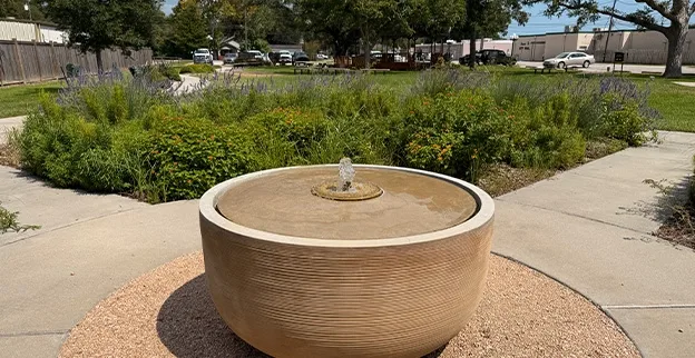 A fountain in the Mae S. Bruce Therapeutic Garden in Santa Fe, Texas, across the street from the Santa Fe City Hall building.