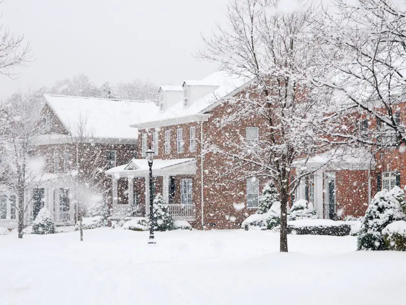 Houses during a snowstorm.